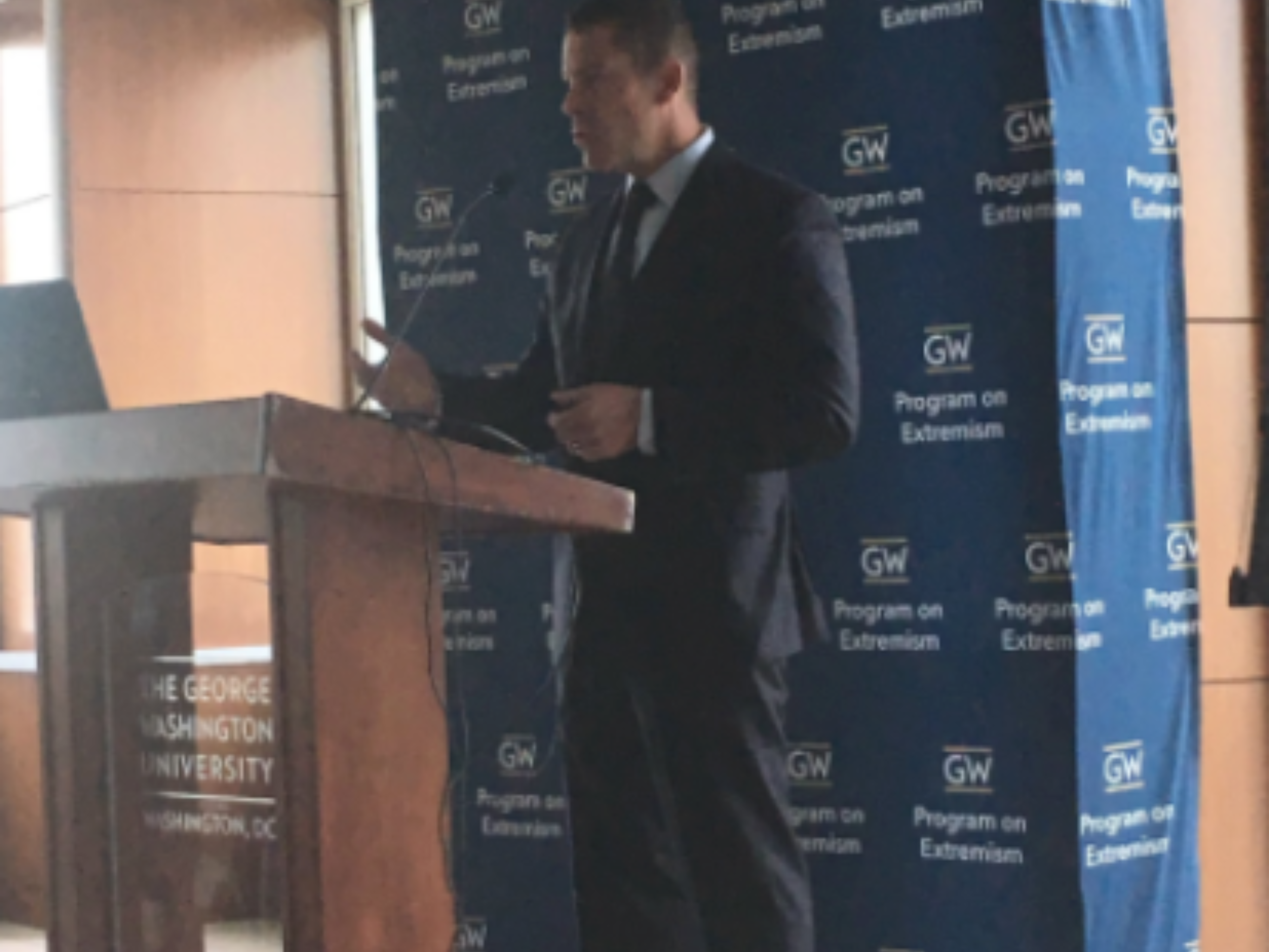 An image of Thomas E. Brzozowski, Counsel for Domestic Terrorism at the U.S. Department of Justice, delivering remarks.